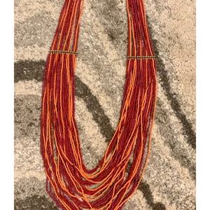 Multi layered red, orange, pink statement necklace